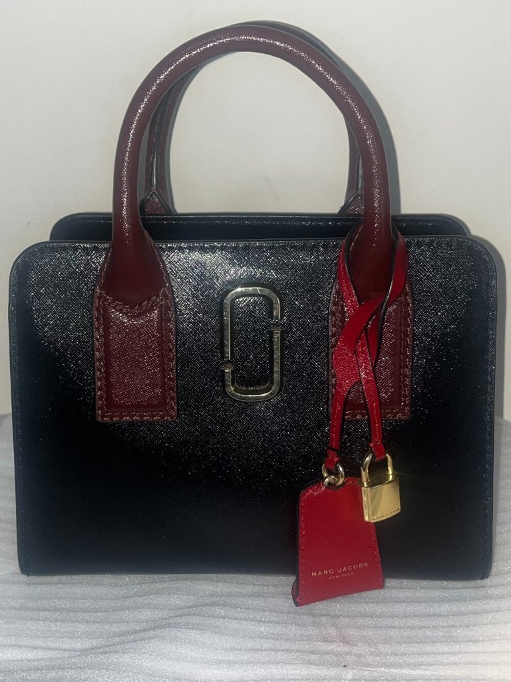 Marc Jacobs Little Big Shot Tote in a black and "Chianti" red colorway.